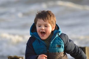 autistic child outdoors beach